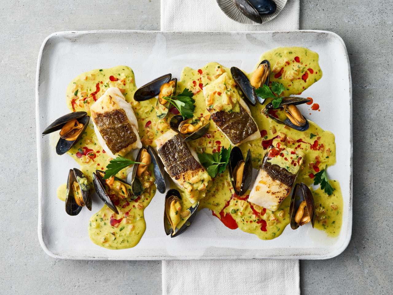 Kabeljaufilets mit Miesmuschel-Curry-Sauce
